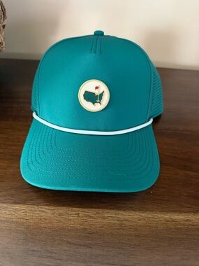 Masters Teal Performance Trucker Hat with Green Tag